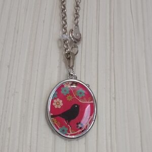 Reversible bird necklace